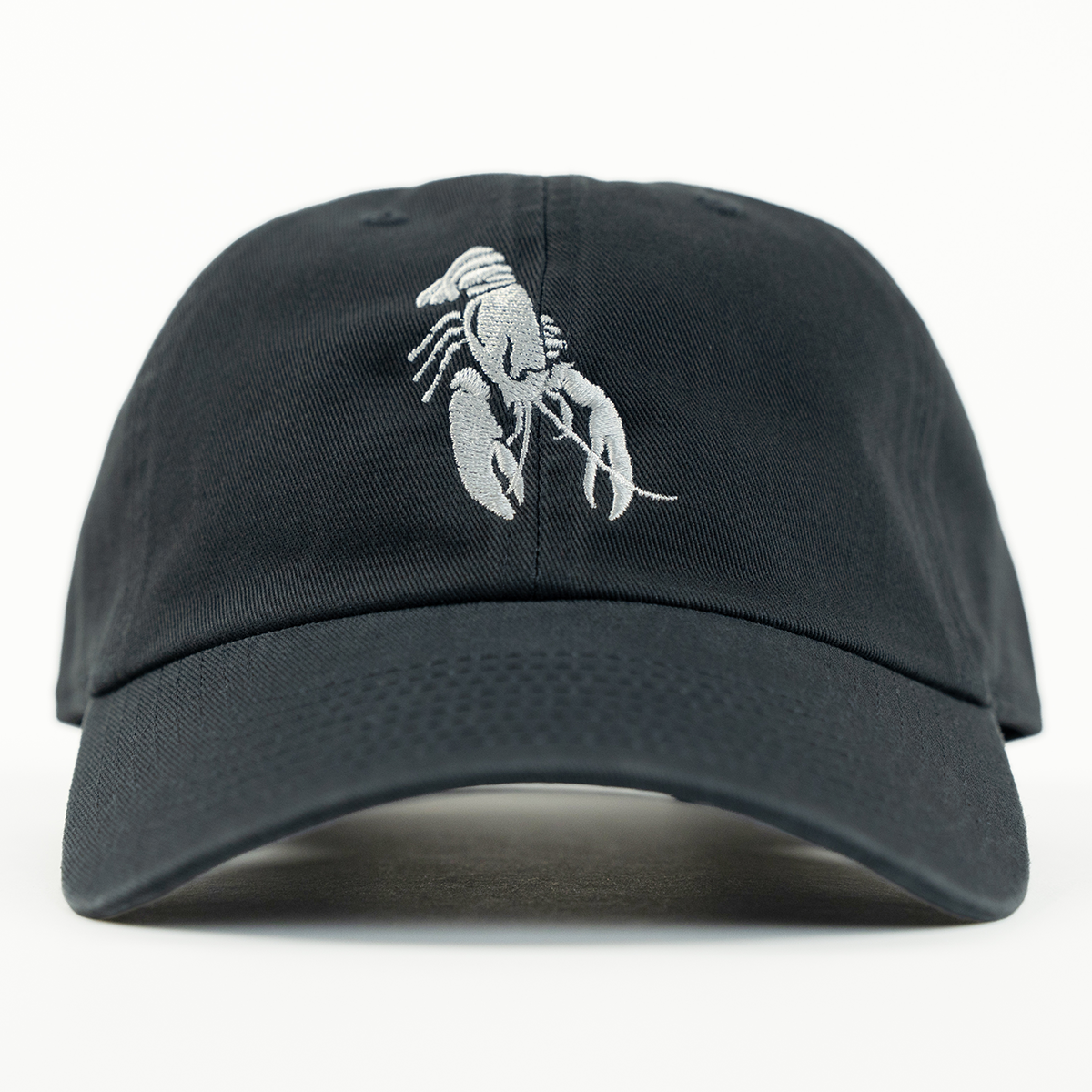 Black cap with a white lobster emblem on a white background