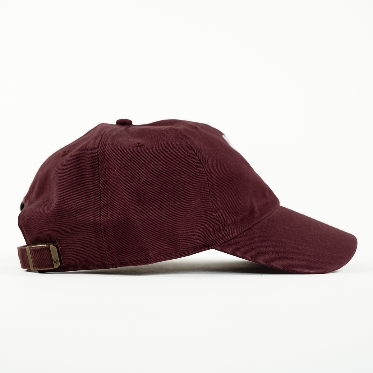 Maroon baseball cap with a gold buckle on a white background