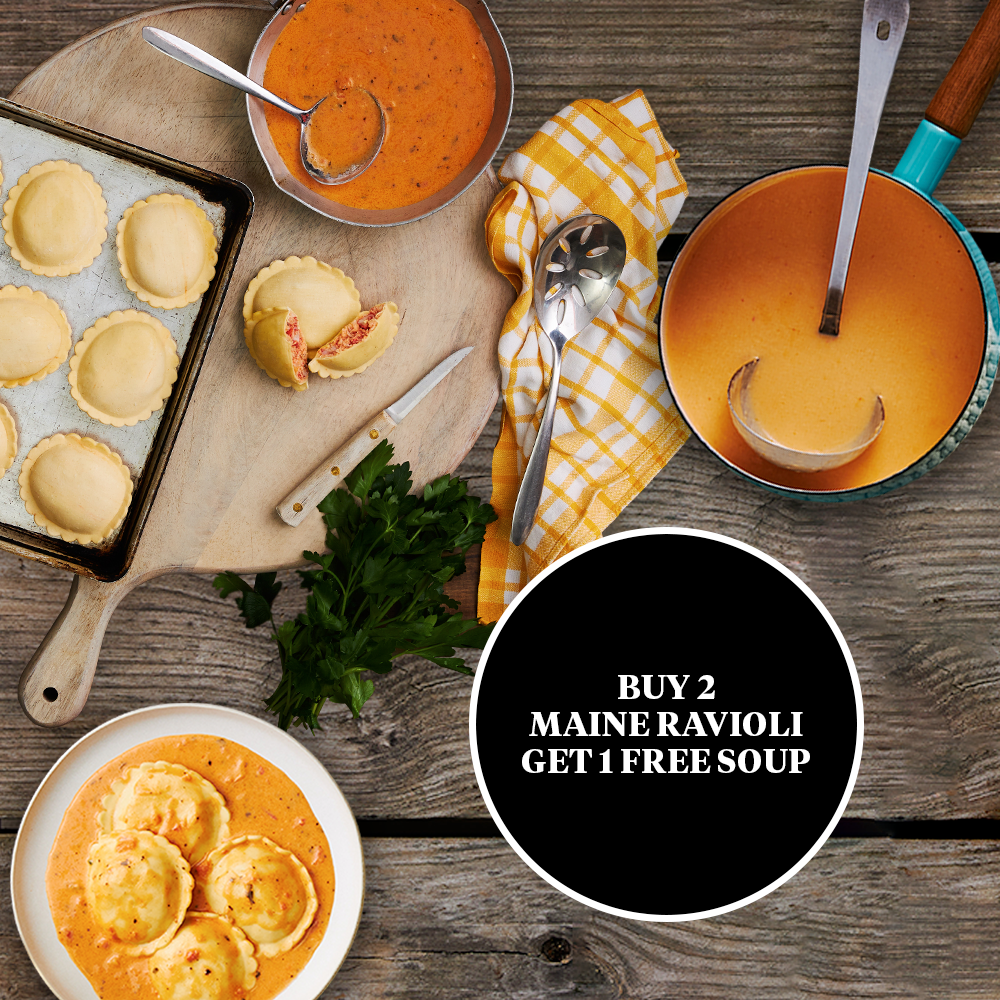 Dish of ravioli, bowls of soup, and a promotional offer on a wooden table.