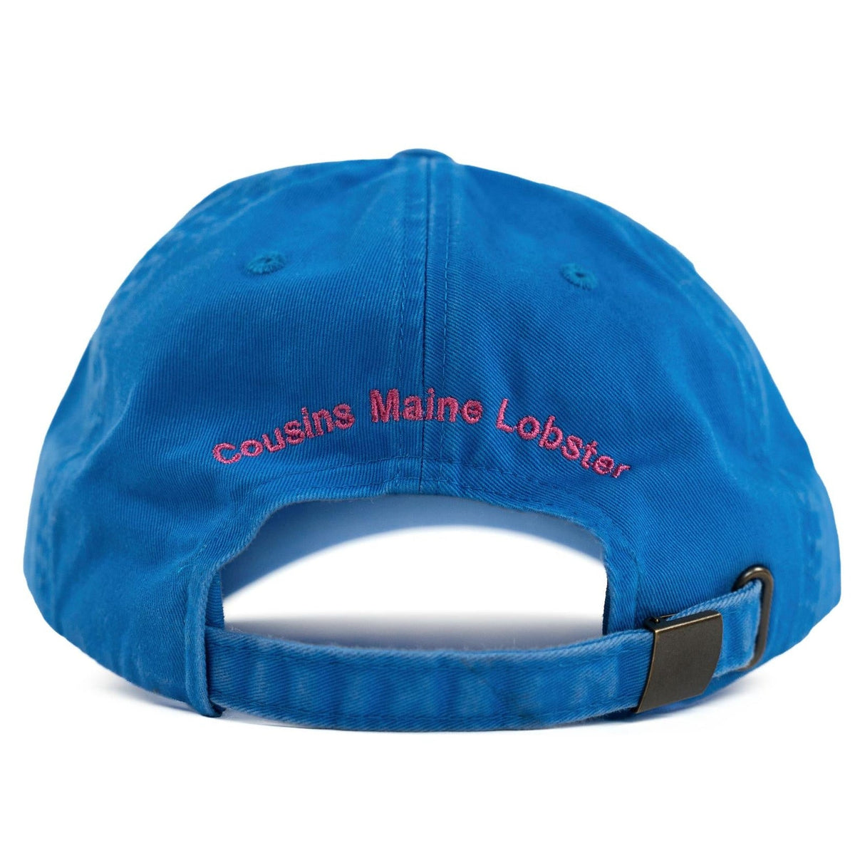 Back of a faded blue dad hat with pink embroidered Cousins Maine Lobster text and buckle strap